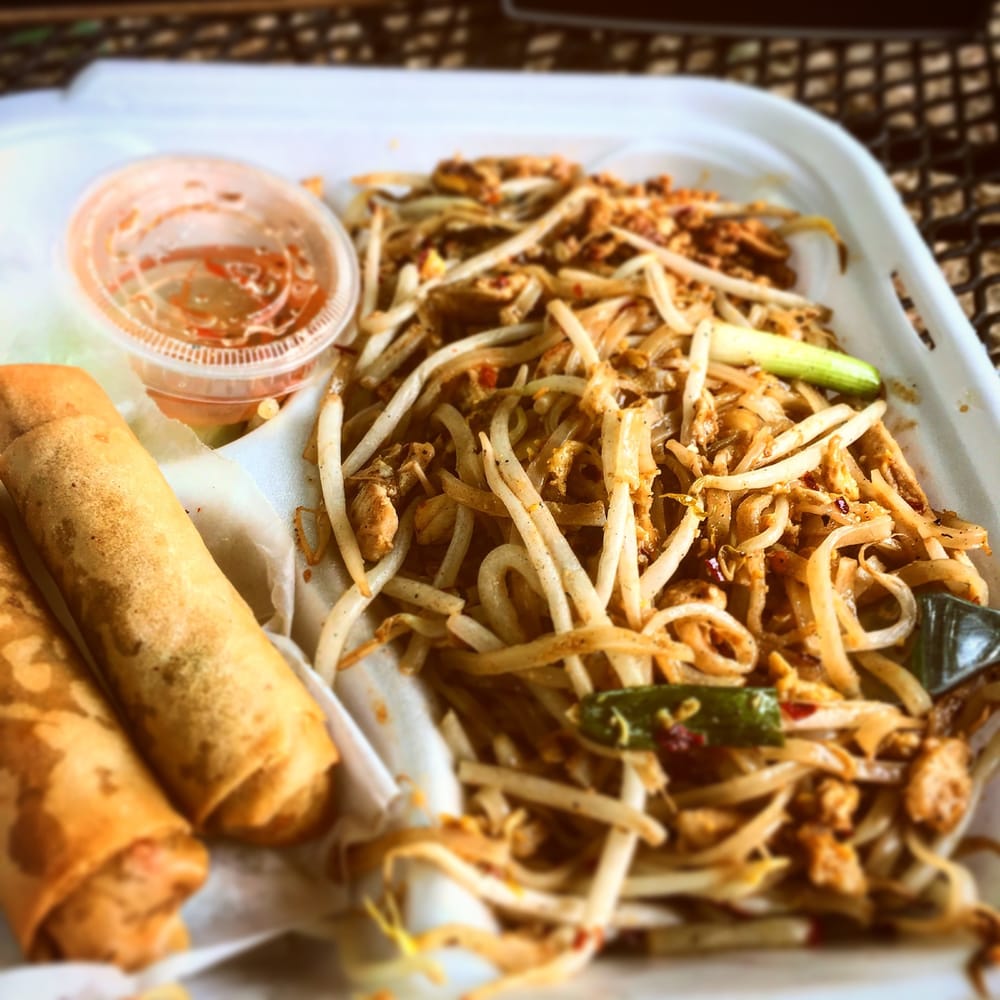 Pad Thai served with crispy spring rolls and sweet chili sauce